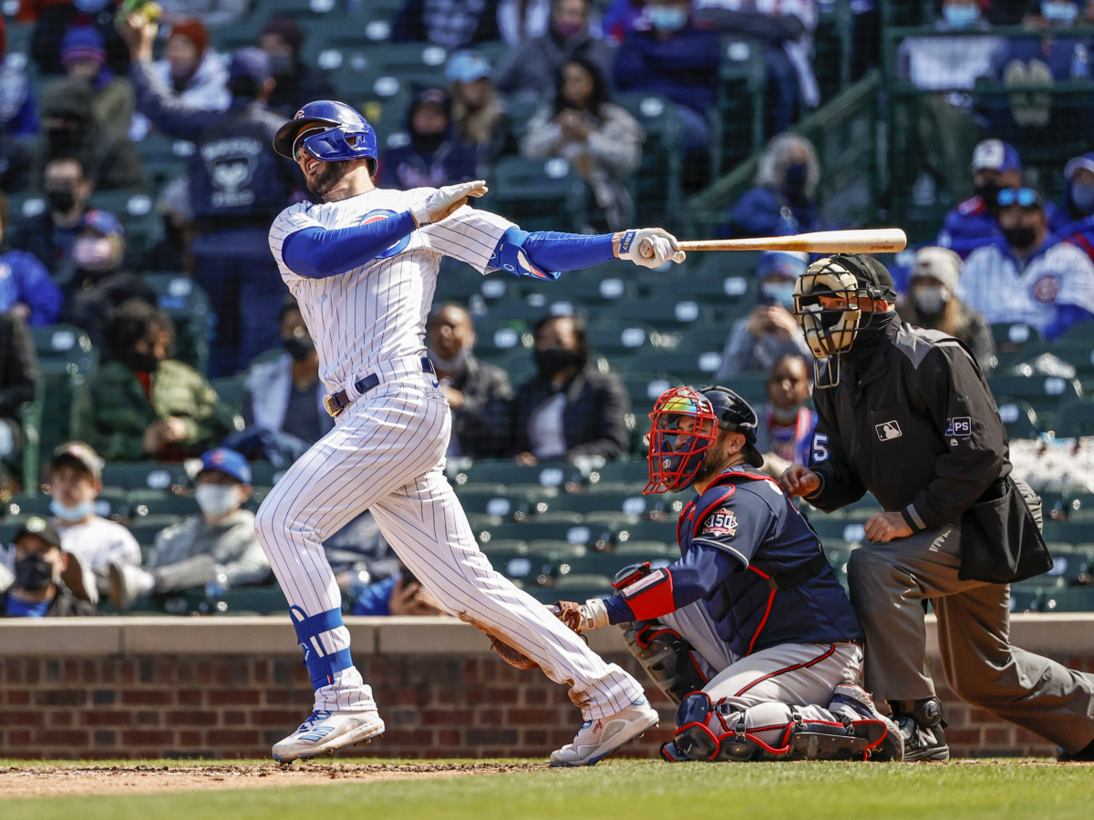 Apr 17, 2021; Chicago, Illinois, USA; Chicago Cubs third baseman Kris Bryant (17) hits a two-run home run against the Atlanta Braves during the fifth inning at Wrigley Field.